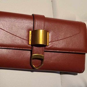 RUDSAK leather rust color and brass hardware long folded wallet